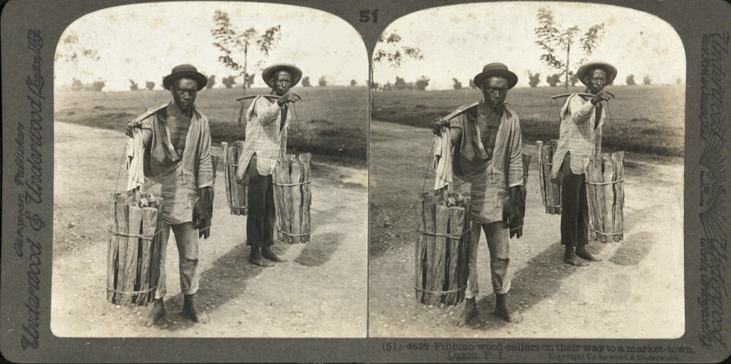Filipino wood-sellers on their way to a market-town, Luzon, P. I.